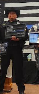 Exact crop of Deputy Miguel Bittony from the supplied award photograph