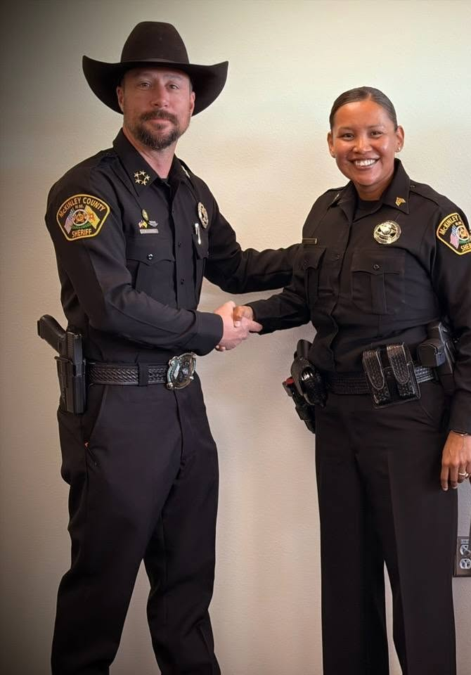 Savannah Benally shaking hands with Sheriff James Maiorano III