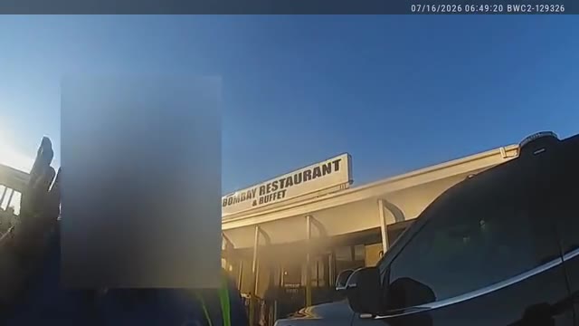 Frame from the redacted Bittony bodycam outside Bombay Restaurant